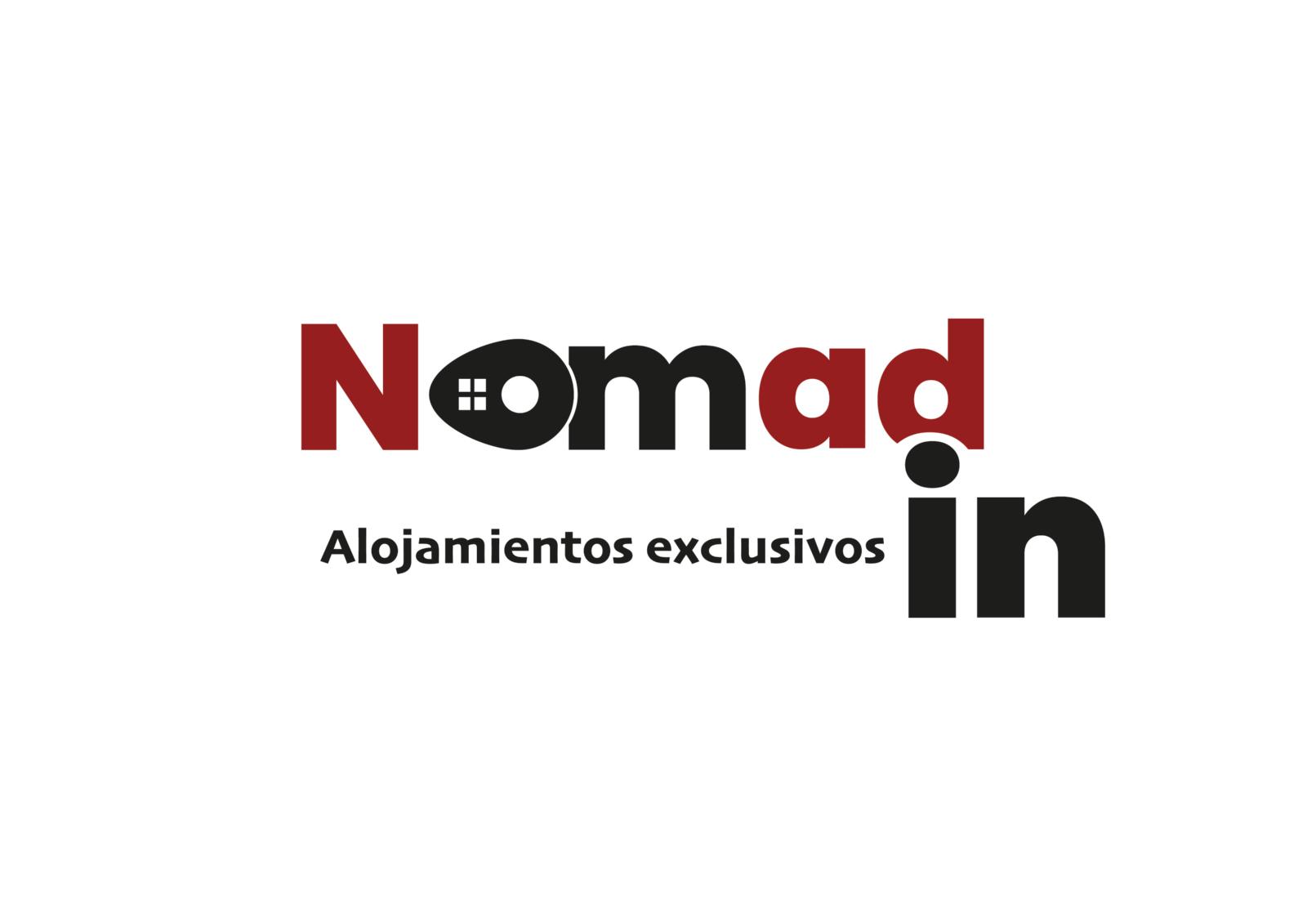 Nomad In logo with the word "Nomad" in red, the "o" as a house symbol, and "in" in black